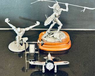 Left to right ($60 - Jac Zagoory Designs pewter pen holder - 5” wide x 2.5” tall) ($28 - Weight bench clock - 3.5” wide x 2.5” tall) ($30 - Fossil airplane clock - 4.5” wide x 1.5” tall) ($130 - Chilmark “Mandan-Buffalo Dancer” fine pewter sculpture limited edition - 7” wide x 6” tall)