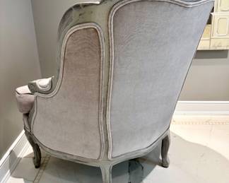 Image of the back of the gray velvet bergere chair.
