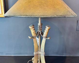 $300 - Unique bronze sword lamp with leather shade, 10” wide base, 20” wide shade x 30” tall