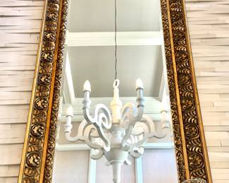 $2,800 - Relief-carved ornate gold arched mirror, 3’ wide x 7.6 tall