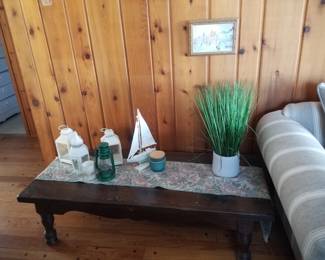 Coffee table; beachy decor. Knotty pine paneling