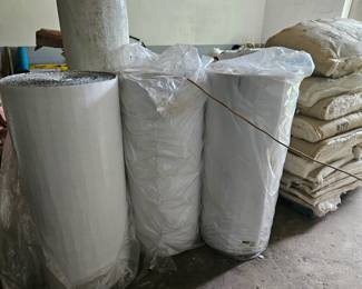 Large rolls of bubble insulation. Basically bubble wrap that got a construction job.