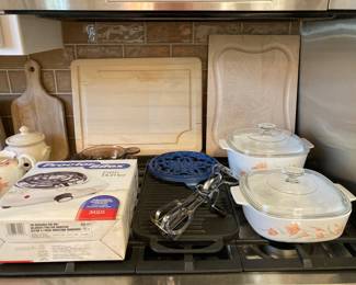 fifth burner, Corningware covered casseroles, cast iron griddle/grill and trivet, wood carving boards