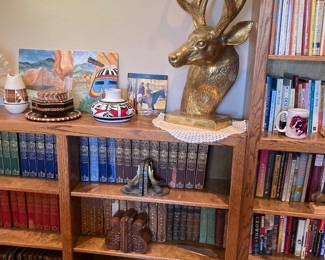 Book collections, brass deer bust, Native American pottery, crystal bowl, etc.