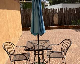 bistro patio table with two chairs and umbrella