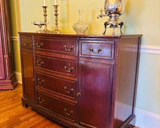 Antique water kettle on sideboard