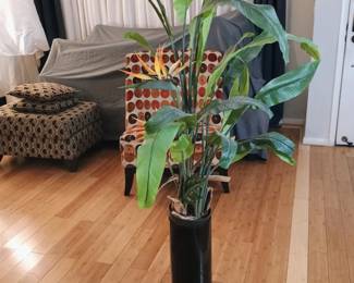 Realistic tall artificial Bird of Paradise tropical tree in high-gloss black floor planter.