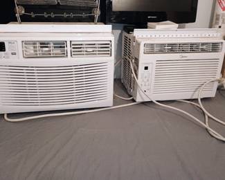 Pair of functional digital window air conditioner units up for sale – Della and Midea models. Only used one summer