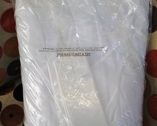 Row 5Brand new, factory-sealed David's Bridal slip and protection bag in original retail plastic.