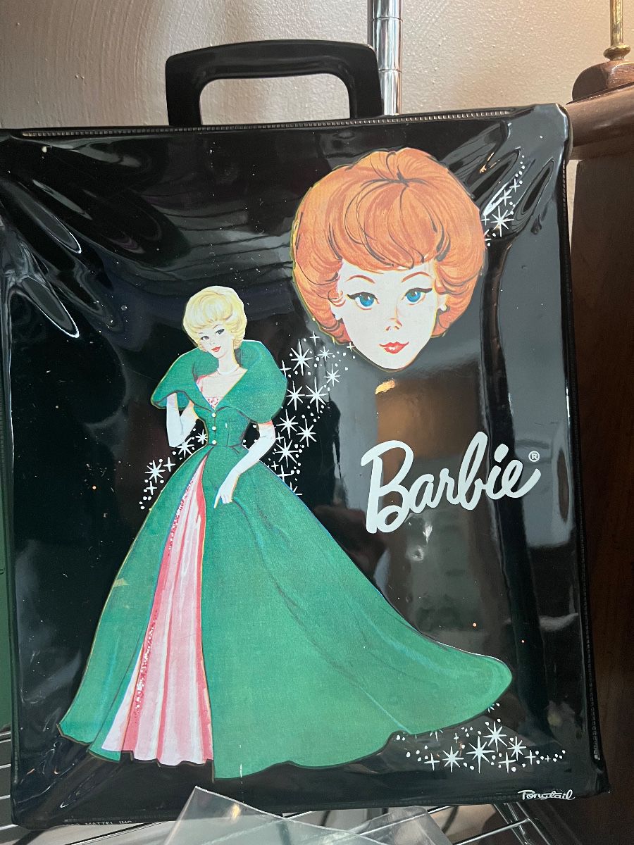 Boxed Barbie doll wearing a green outfit at a Virginia Beach estate sale