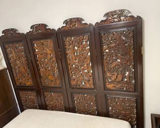 An Antique 4- panel hand-carved wooden room devider featuring a Peacock & floral motif.