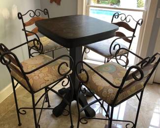 High top Pub table with upholstered iron and wood barstools
