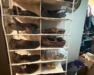 Fabric Hanging Closet Shoe Organizer with Multiple Shelves
Condition: Good
Tall soft-sided hanging closet organizer with multiple shelf compartments for shoes or small accessories. Beige/tan fabric with white or light edging and hanging structure; used condition, with contents shown in several pockets. No visible brand labeling in the image.