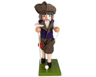 Wooden Golfer Nutcracker Figurine
Condition: Good
Single standing wooden nutcracker-style golfer figurine with painted eyes, gray hair/beard detail, plaid houndstooth clothing, white sleeves, dark shoes, a golf club accessory, and a green rectangular base. Appears to be decorative display art rather than a functional toy.