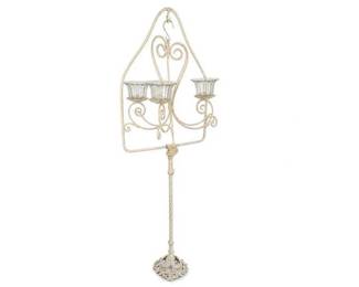Cream wrought iron 3-light floor candelabra stand with glass cups
Condition: Good
Tall decorative floor candle holder/ candelabra in a light cream finish with three scroll-arm candle cups, a twisted central stem, and an ornate openwork base. Primary visible materials appear to be painted metal/iron with clear glass cup inserts. No cords, electrical parts, or branding visible.