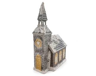 Snow-dusted resin church miniature with steeple and gold-tone doors
Condition: Good
Small decorative church/chapel miniature with a tall steeple, textured stone-like surface, gold-tone front door and circular window accents, and heavy white 'snow' effect on the roof and edges. Likely resin or similar molded material.