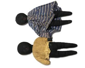 Handmade Black Americana cloth rag doll pair
Condition: Fair
Two handmade cloth dolls with black fabric heads/limbs, simple stitched facial features, one dressed in a blue-and-tan striped dress and one in a mustard-yellow top. Visible condition shows general wear, loose threads, and soft construction consistent with folk-art or homemade decorative dolls.