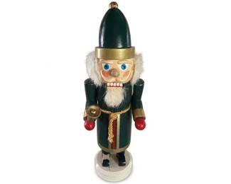 Wooden Christmas nutcracker soldier in green and gold uniform
Condition: Good
Painted wooden nutcracker soldier with dark green coat, gold trim, red accent stripes, white fur hair and beard, blue eyes, black hat with gold band, red glove-like hands, and round white base. Appears to be a decorative holiday figure, likely about 9–16 inches based on proportions versus typical sold examples, but exact size is unverified.