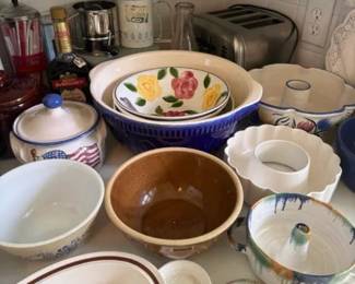 Vintage Hand-Painted Ceramic Mixing and Serving Bowls Mixed Lot
Condition: Good
Assorted ceramic/stoneware kitchenware lot including multiple mixing bowls, a handled bowl or small pitcher, and at least one floral-decorated piece. Visible condition appears used with normal surface wear; no obvious large cracks are visible from the photo, but underside chips and hairlines cannot be ruled out.
