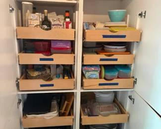 Wood pull-out cabinet organizer drawer lot, 8 installed slide-out shelves
Condition: Good
Lot of eight installed wood pull-out cabinet organizers / slide-out pantry drawers inside a kitchen cabinet. Mixed stored contents are present, but the salable object is the organizer hardware itself rather than the contents.