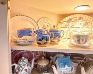 Blue and white ceramic miniature tea set and mixed tableware lot
Condition: Good
Decorative ceramic tea-service lot in blue-and-white and multicolor patterns, including at least one teapot, several cups and saucers, plates, and small covered or novelty pieces. The group appears to be display china / cottage-style kitchen decor rather than a single cohesive service.