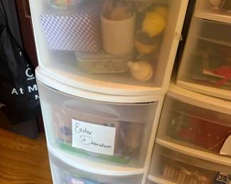 Clear Plastic 3-Drawer Storage Organizer Tower
Condition: Good
Clear plastic, white-framed 3-drawer storage organizer tower with curved drawer fronts. The drawers appear to hold assorted seasonal items; one drawer is labeled 'Easter Decorations.' Adjacent matching storage units may be present at right, but the primary salable object is the left-hand three-drawer tower.