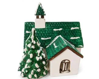 Glazed ceramic Christmas village church with evergreen tree
Condition: Good
Small ceramic or porcelain holiday village structure: white church building with a textured green roof, matching green steeple, and a separate snow-dusted evergreen tree attached or positioned in front. Appears to be a tabletop Christmas village collectible.