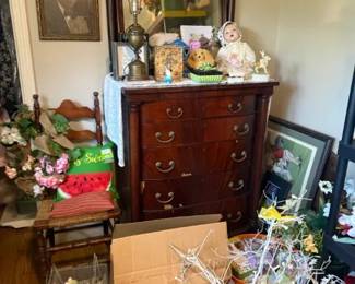 Mahogany Tall Dresser with Mirror and Brass Pulls
Condition: Good
Dark mahogany-toned tall dresser/chest of drawers with attached mirror, brass ring pulls, and multiple stacked drawers. The piece appears to be a freestanding bedroom case piece; visible surface wear is moderate but no obvious structural break is apparent from the photo.