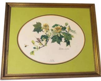Framed Botanical Flower Print with Green Mat and Gold Frame
Condition: Good
Decorative framed botanical print showing a flowering branch with yellow blossoms and green leaves on a cream oval field, surrounded by a bright green mat and gold-toned frame. The visible inscription/signature area is too faint to identify confidently from the image. Likely a mass-market or limited-edition wall art print rather than original hand-painted art, but that cannot be confirmed from the photo alone.