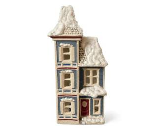 Ceramic Christmas village house with snow-covered roof and red door
Condition: Good
Tall narrow village-house miniature with blue walls, cream window trim, multiple snow-laden roof sections, and a dark red front door. The piece appears to be ceramic or porcelain holiday decor, likely meant as part of a Christmas village display.