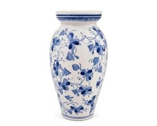 Blue and White Floral Porcelain Vase
Condition: Good
White porcelain vase with all-over underglaze blue floral/vine decoration, short flared mouth, rounded shoulder, and narrow foot. Decorative accent piece; likely Asian-inspired or Delft-style modern decorative ware rather than a clearly attributable antique.