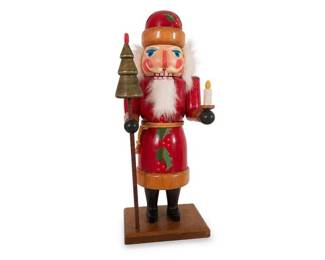 Wooden Christmas Santa Nutcracker Figurine with Candle and Tree Staff
Condition: Good
Decorative Christmas nutcracker-style Santa in red paint with white faux beard, black boots, rope belt, holding a small candle in one hand and a tree-shaped staff in the other, mounted on a wooden base.