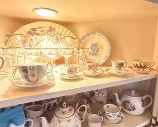 Assorted Vintage Porcelain Teacup and Saucer Lot with Floral Gold Trim
Condition: Good
Mixed porcelain teacup/saucer grouping displayed on shelves, with floral motifs, gold/gilt trim, and several different cup/plate designs. The lot appears to include more than one pattern and is best sold as an assorted decorative tea-service lot rather than as a single matched service.