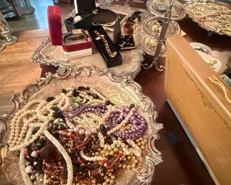 Mixed costume jewelry lot of beaded necklaces and bracelets
Condition: Fair
Large mixed lot of costume/fashion jewelry, mostly beaded necklaces and bracelet strands in white, gold, black, purple, red, and multicolor tones. Pieces appear to be assorted, used, and partially tangled in ornate trays; likely estate-sale loose stock rather than a coordinated set.