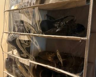 Clear Pocket Hanging Shoe Organizer
Condition: Good
Single clear-pocket hanging shoe/closet organizer in beige/tan fabric with transparent front pockets. Used condition with visible wrinkling/waviness and some wear to the fabric edges; contents include shoes inside some pockets. No brand markings are visible in the image.