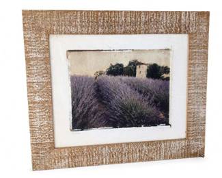 Framed Rustic Lavender Field Landscape Print
Condition: Good
Single framed decorative print showing a lavender field or similar purple floral landscape with a small distant tower/building and trees. Thick textured tan frame, white mat, and print appears to have slight edge wear or aging at the visible margins.