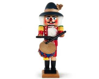 Wooden nutcracker drummer figurine with black hat and red uniform
Condition: Good
Single wooden nutcracker-style drummer figure with red coat, black boots, black hat with tan band and plume, white beard, and attached drum on a wood base. Decorative Christmas/seasonal collectible appearance.