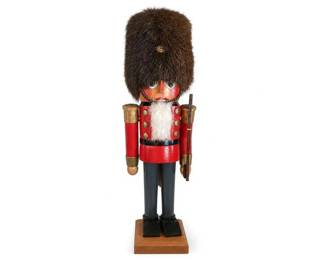 Wooden Nutcracker Soldier with Rifle
Condition: Good
One wooden nutcracker soldier figurine with tall black fur hat, red jacket with gold trim/buttons, white beard/chest tuft, black pants/boots, and a rifle accessory. The painted finish and folk-art styling suggest a decorative holiday piece. No secondary items are part of the salable object.
