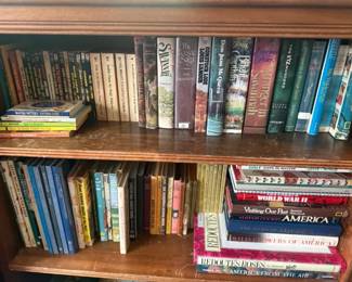 Mixed Vintage Hardcover and Paperback Book Lot
Condition: Good
Assorted used books on two shelves, including visible titles in history, wildflowers/gardening, fiction, travel, and reference subjects. Visible examples include individual hardcovers and paperbacks such as WWII/history titles, wildflower books, and general Americana/reference volumes. Condition appears mixed but generally serviceable from the front view, with some shelf wear and age toning likely.
