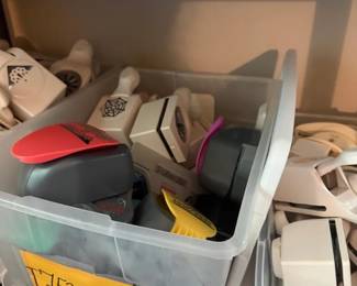 Fiskars Craft Paper Punch Lot
Condition: Good
Assorted handheld craft/paper punches in clear storage bins, including corner/shape punches and several different top colors and cutout icons. Visible condition appears used with normal handling wear; exact models and full count are not verified from the image.