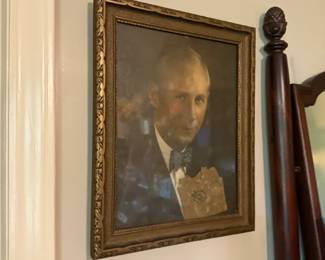 Ornate gilt-framed portrait of a man
Condition: Fair
Framed portrait depicting a formally dressed man in a bow tie, housed in an ornate gold-tone frame. The image suggests an antique or vintage decorative portrait rather than a modern print, but medium/type cannot be confirmed from the photo alone.