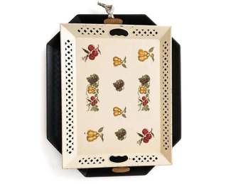 Vintage hand-painted fruit motif metal tole serving tray with lattice edge
Condition: Good
Rectangular decorative serving tray with a cream center panel, fruit decoration, black metal base, and pierced/lattice trim around the perimeter. The top and bottom cutout handles suggest it is intended for serving or display. Condition appears used with visible age-related wear but no major breakage visible in the photo.