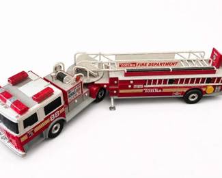 Tonka Fire Department 88 Aerial Ladder Fire Truck Toy
Condition: Good
Red-and-white Tonka fire department ladder truck toy with extended aerial ladder, cab-mounted equipment, and side stabilizer detail. Primary object only; no secondary items appear relevant.