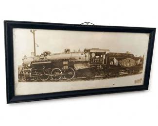 Atlantic Coast Line Framed Steam Locomotive Print
Condition: Fair
Framed sepia railroad print showing an Atlantic Coast Line steam locomotive, number 1750 visible on the cab. Black frame with hanging wire; image appears to be a printed reproduction rather than an original photograph or painting. Visible age toning/foxing and frame wear.