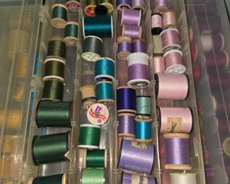 Several containers of thread