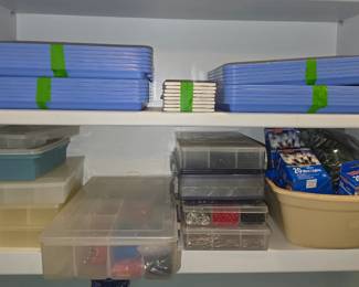 Boxes of craft supplies and blue work trays