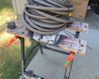 Garden hose and work bench