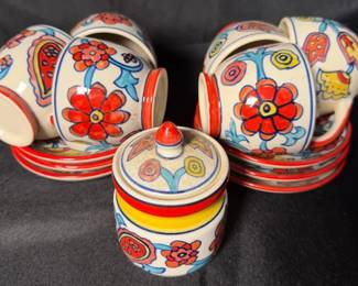 handcrafted ceramic tea and condiment set featuring vibrant handpainted floral