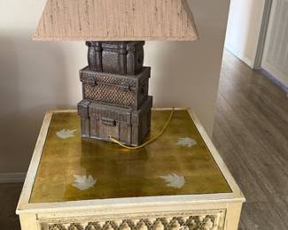 vintage mid-century end table featuring an eglomise leaf-inlay glass top
