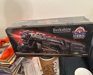 Lionel 1900-2000 Centennial Berkshire Steam Locomotive Collector Tin featuring a black and silver image of the 726 steam locomotive.